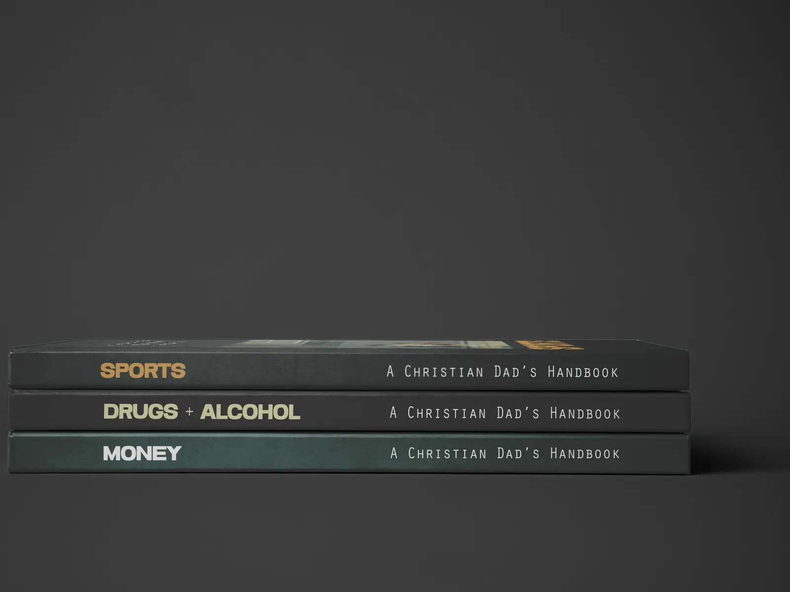 Three handbooks from A Christian Dad's Handbook series stacked spine-out: Sports, Drugs and Alcohol, Money