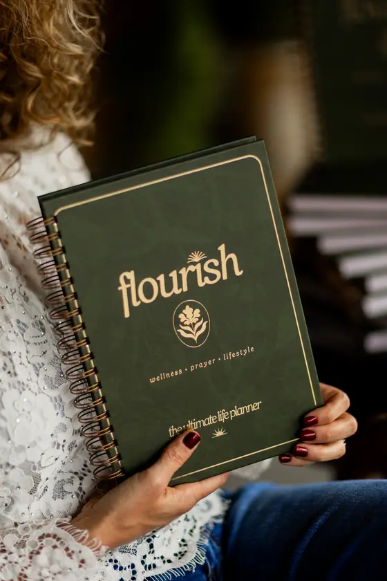 Michelle Johnson holding the Flourish planner